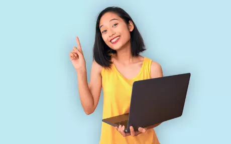 woman with laptop pointing